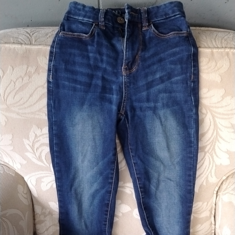 Dark straight-legged blue jeans